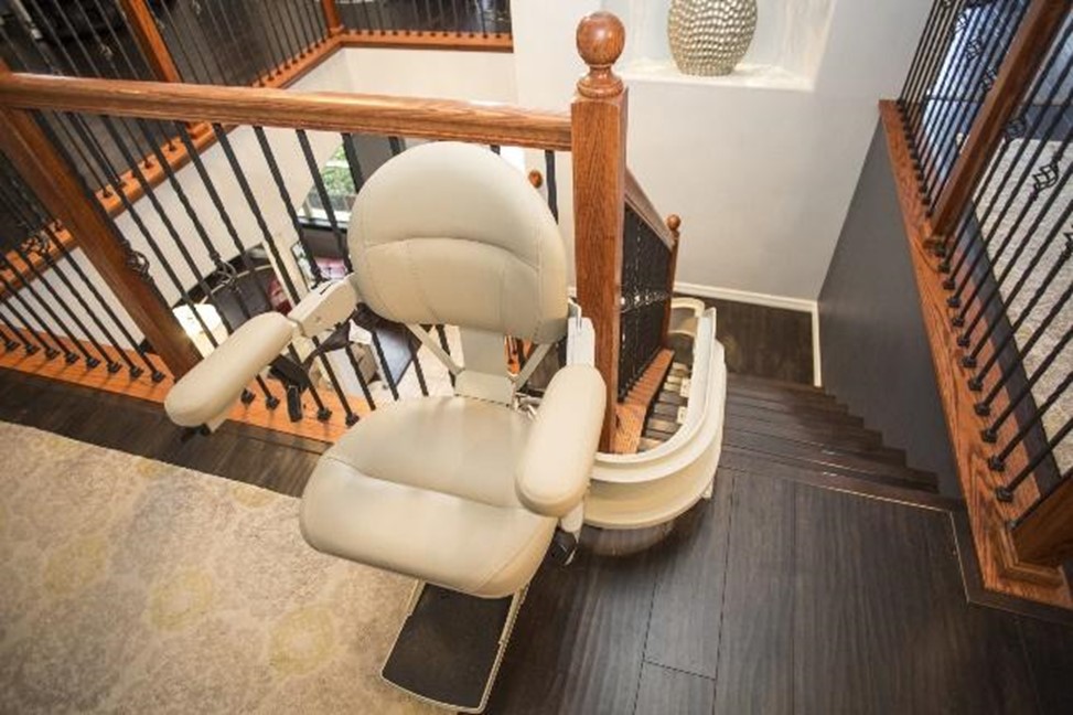 curved stair lift at top of staircase