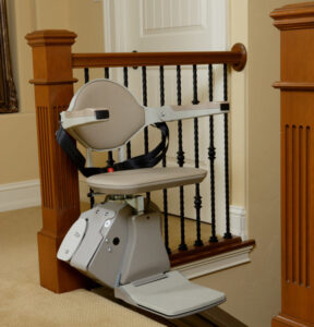 Bruno Elan stairlift resting at the top of the stairs